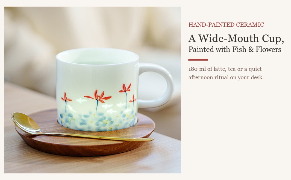 Linglong fish and red spider lily ceramic coffee cup styled on a table