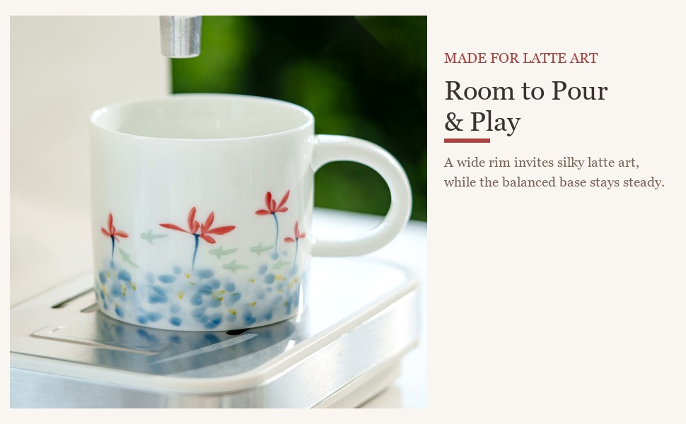 Wide-mouth ceramic cup filled with latte art